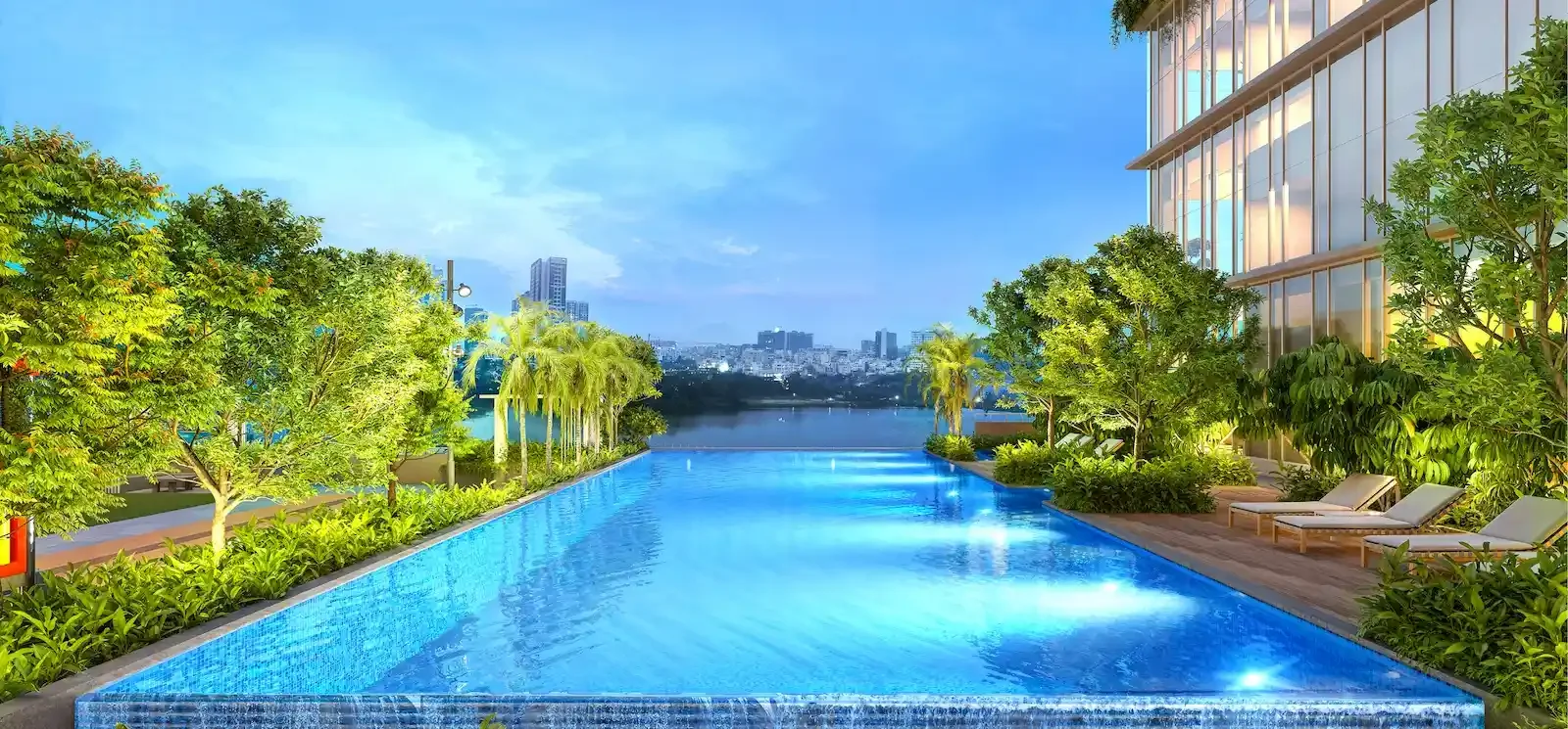 Godrej Aqua Vista pool deck with loungers and dense perimeter planting