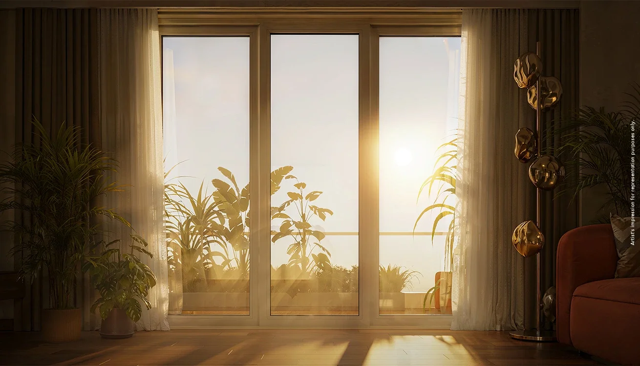 Godrej Elaris apartment living room with full-height windows at sunset