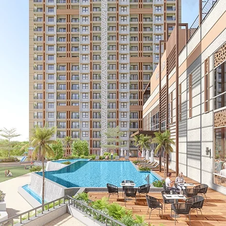 Godrej Hill Retreat resort pool deck with loungers and palm planting