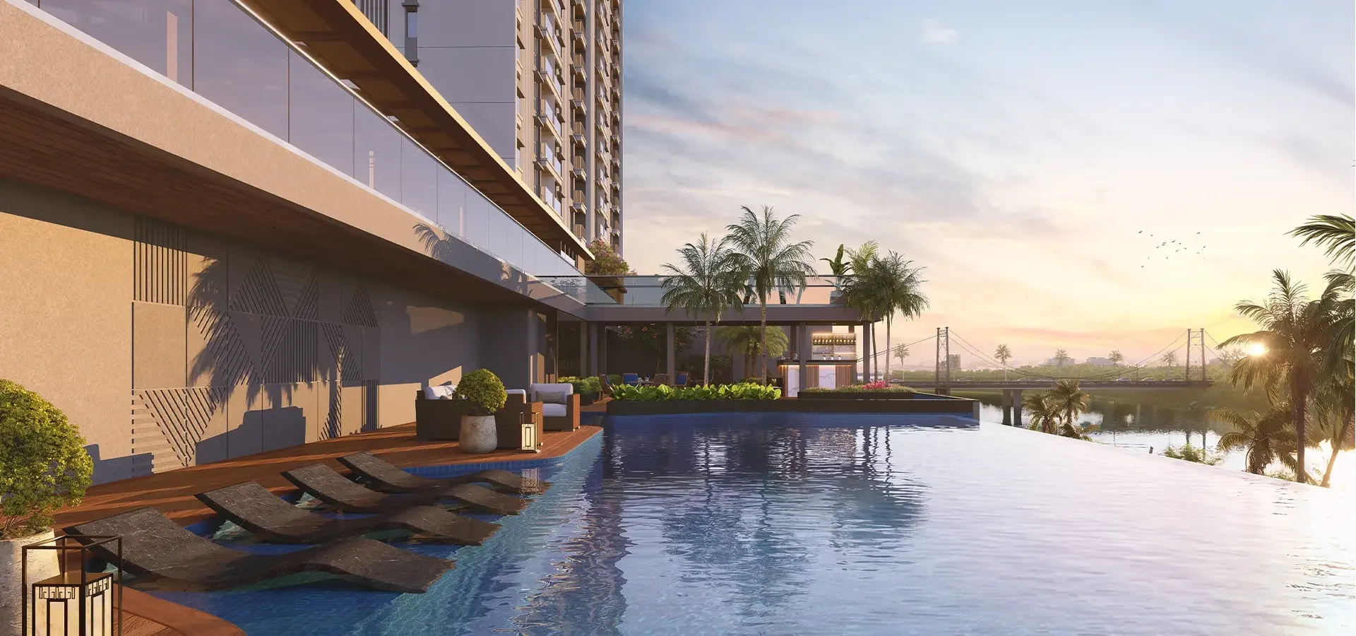 Godrej River Royale infinity-edge pool at sunset overlooking the river