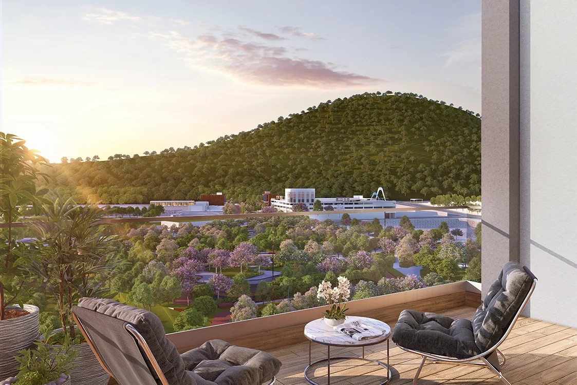 Godrej River Royale balcony seating with the landscaped river frontage beyond