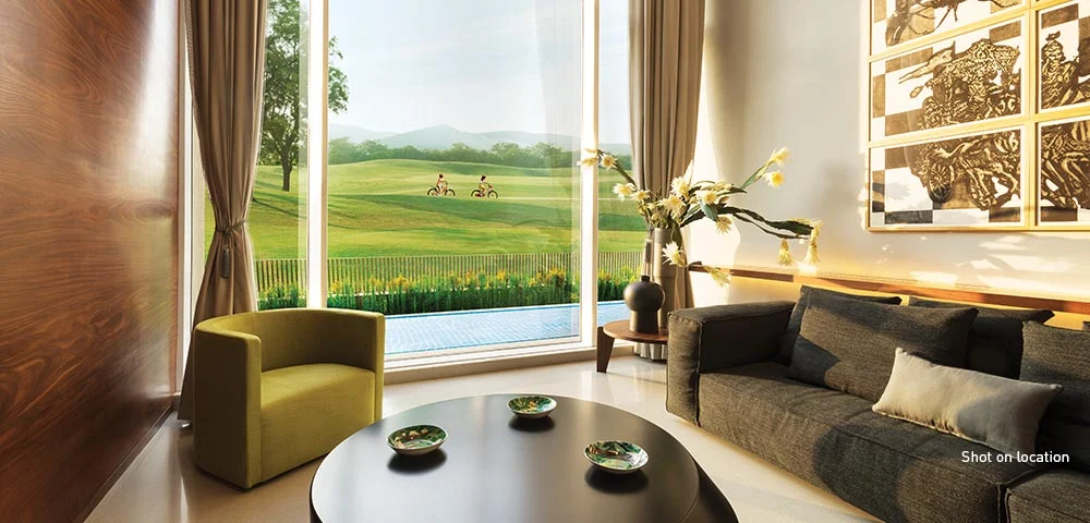 Lodha Belmondo apartment living room framing golf course views