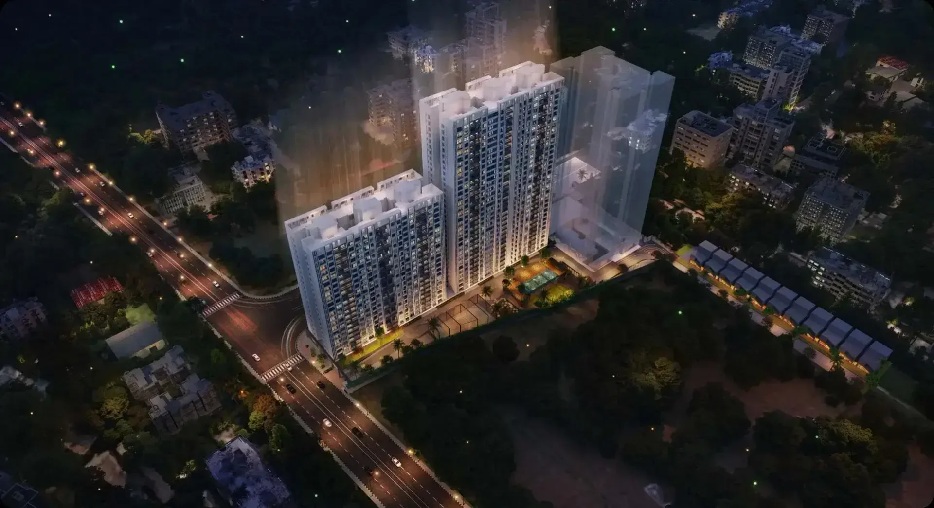 Mantra Magnus night aerial view of the towers beside the Mundhwa road