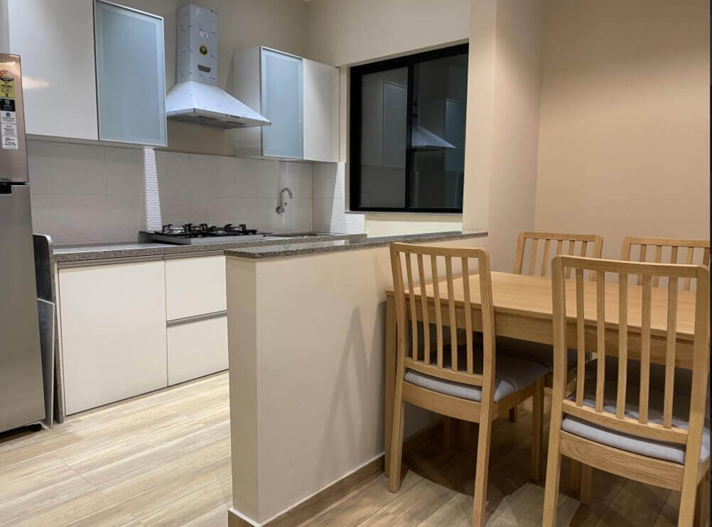 Pride World City modular kitchen and dining area interior