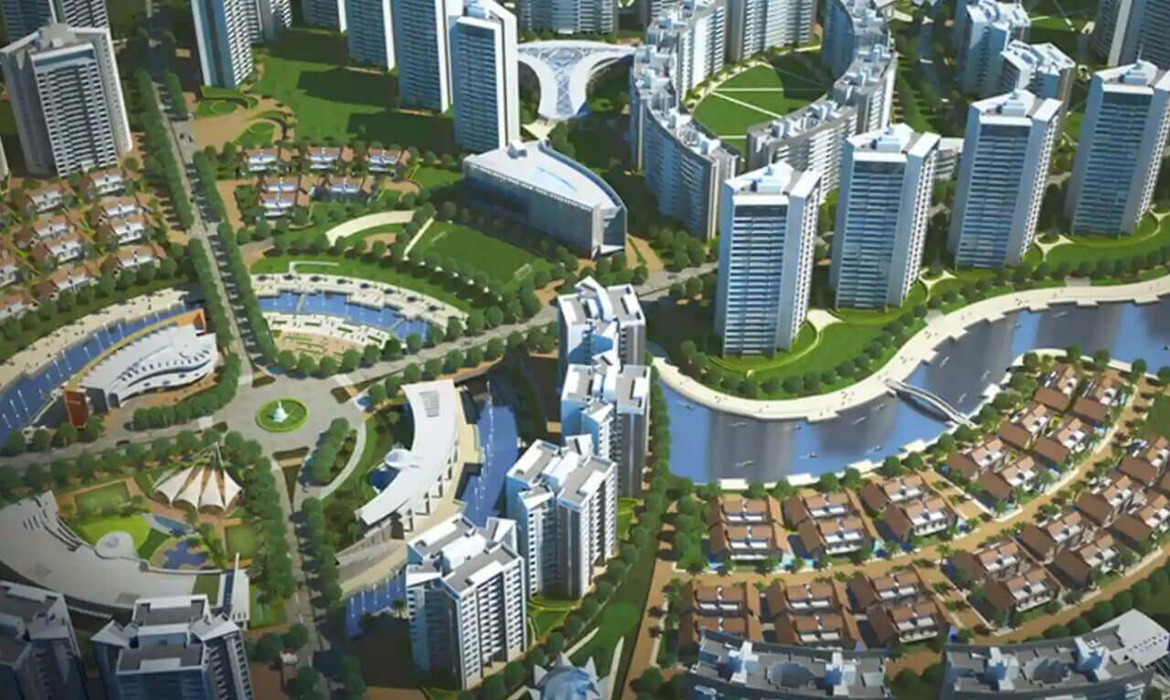 Pride World City township aerial render showing landscaped roads and towers