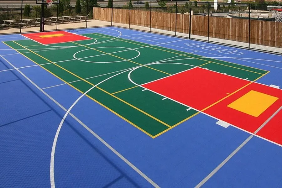 Pristine Kyra multipurpose sports court with basketball and tennis markings