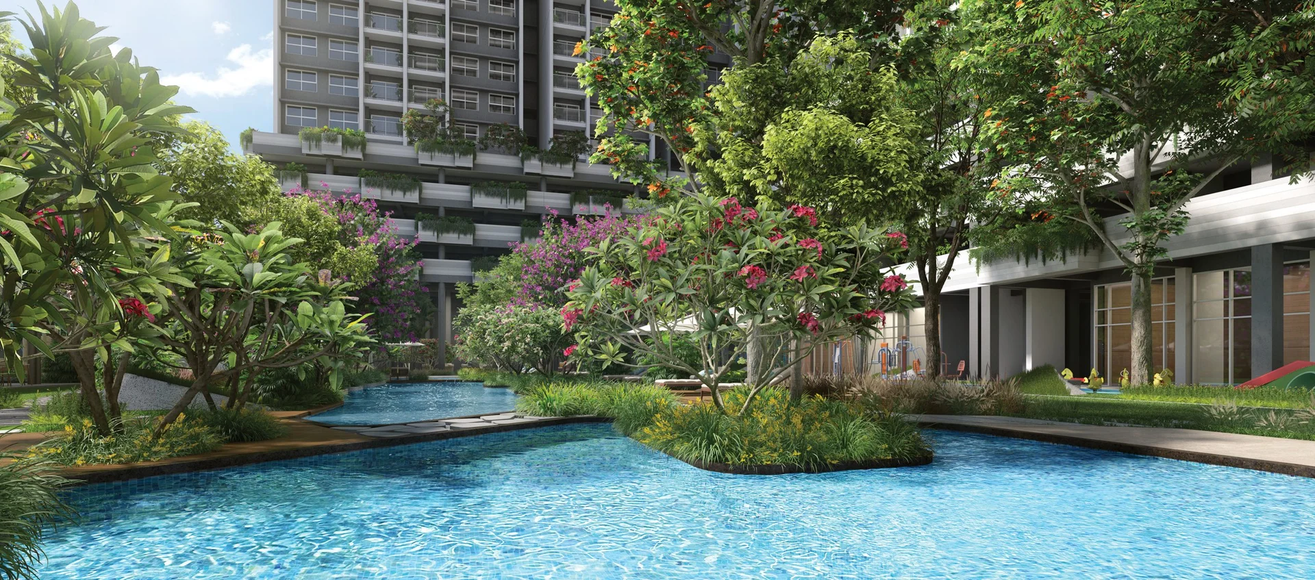 Rohan Harita lagoon-style pool edged with flowering trees